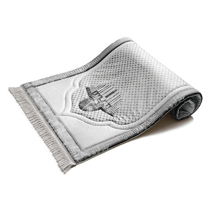 Urban Rugs cushioned prayer rug featuring Kufiya-inspired engraved designs

